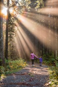 mother and daughter in forest